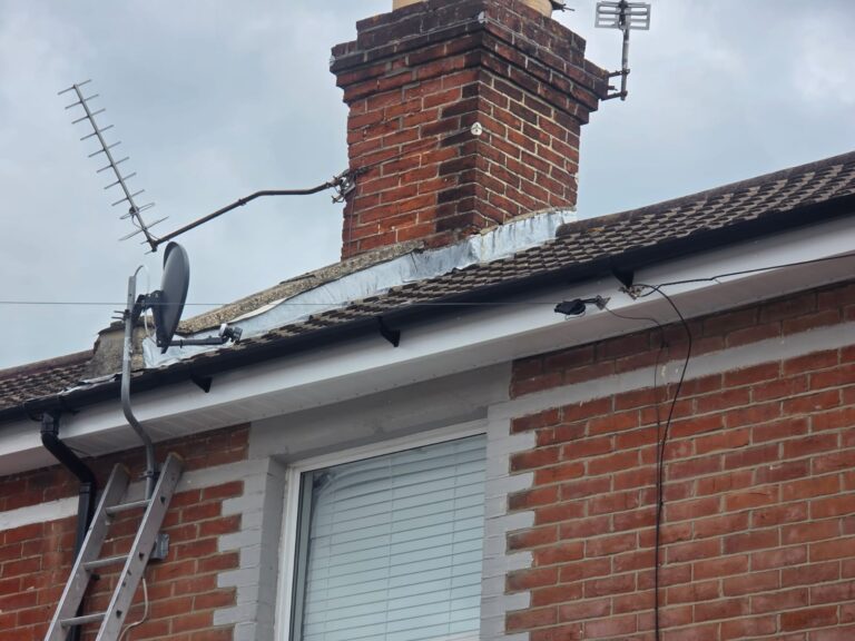 New white uPVC fascias and soffits with black guttering fitted by All Round Roofing on a house in Portsmouth